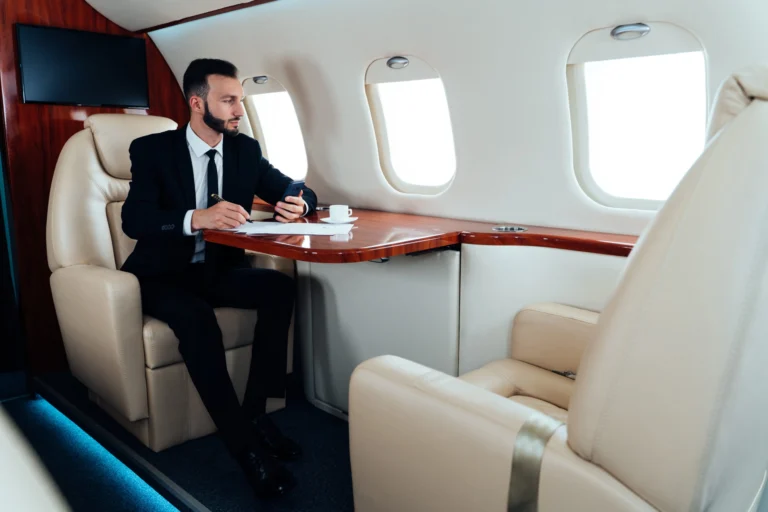 Private jet passengers enjoying luxury flight experience